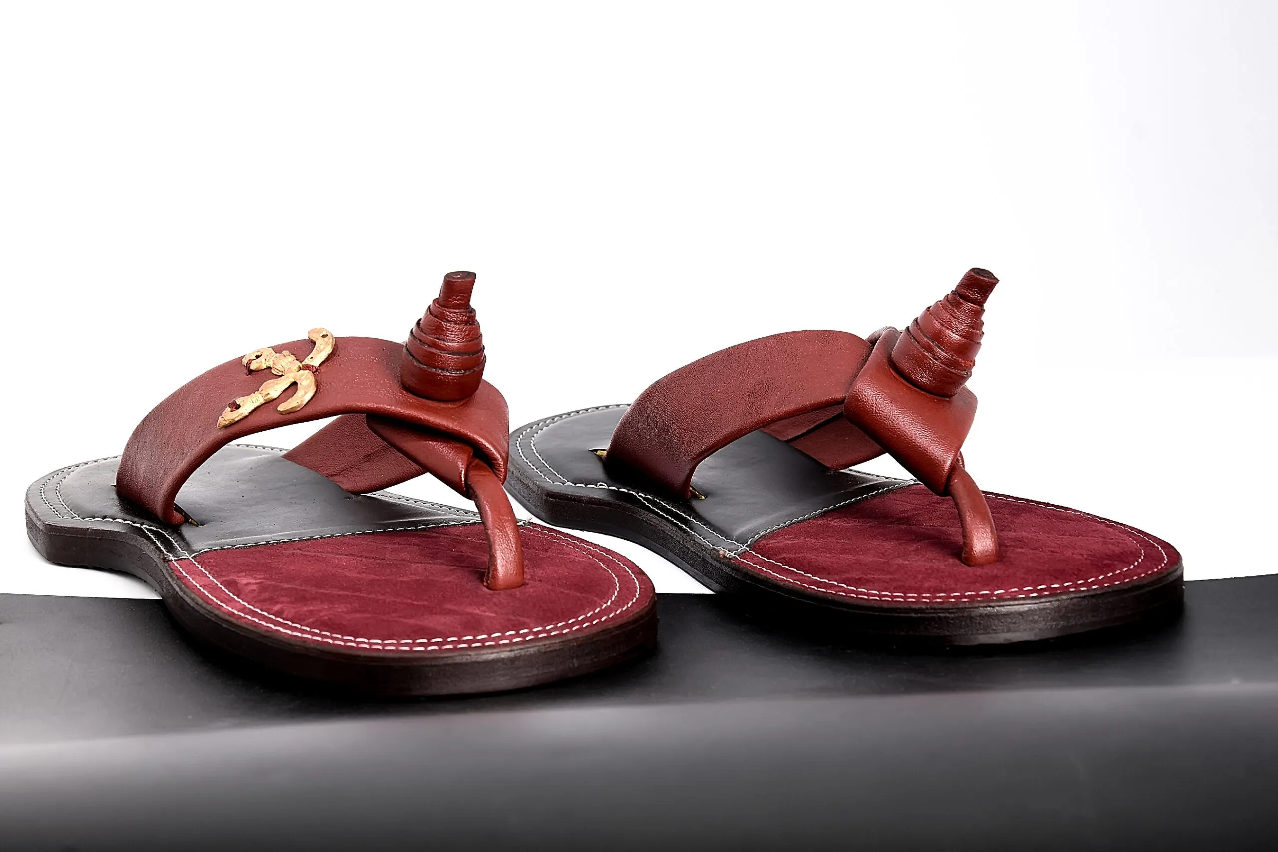 The Akan leather accent Coziest Slippers